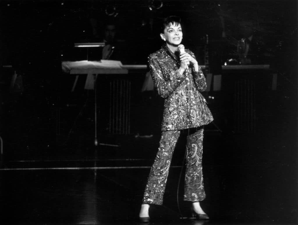 Judy performing on stage. 