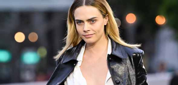 Cara Delevingne goes topless for Vogue and says 'it's all of our jobs' to fight for human rights