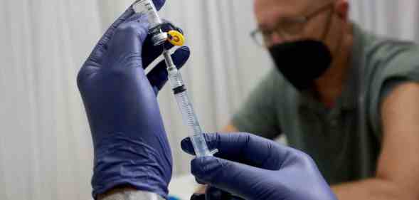 A healthcare worker prepares to administer a monkeypox vaccine in Florida