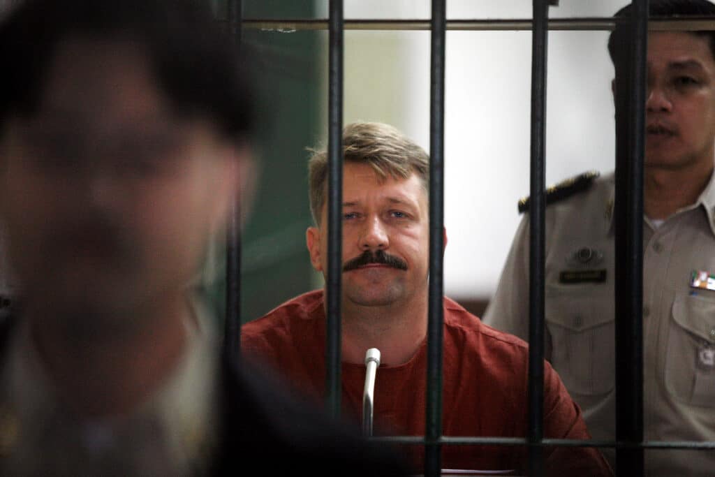  Viktor Bout stands behind prison bars