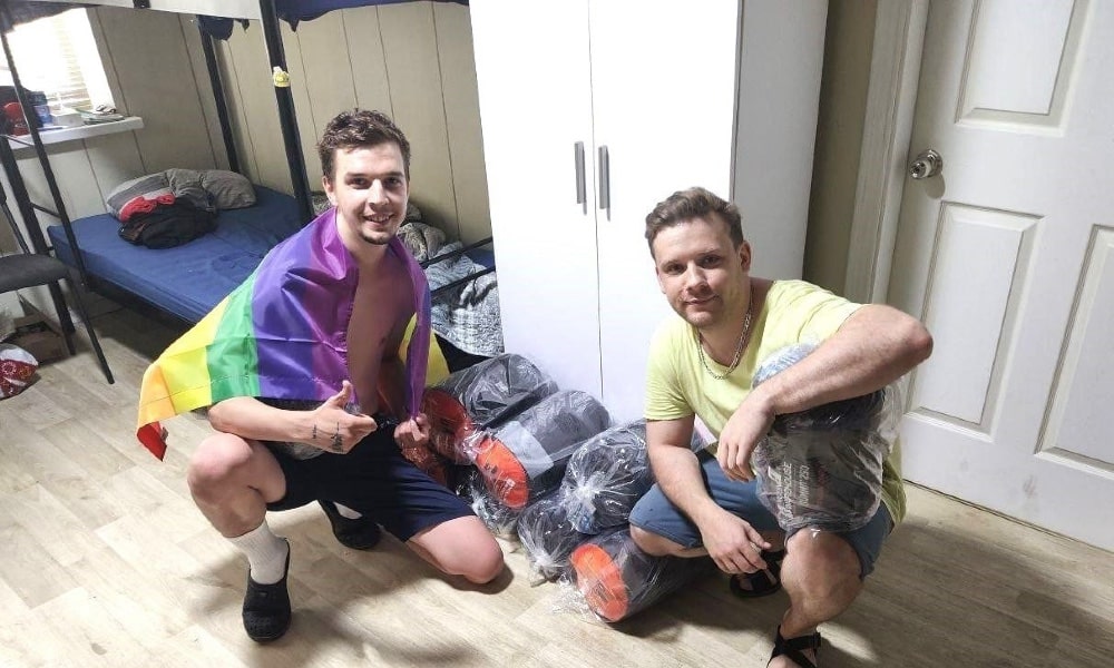 Two activists with Alliance Global pictured in one of their LGBTQ+ shelters.