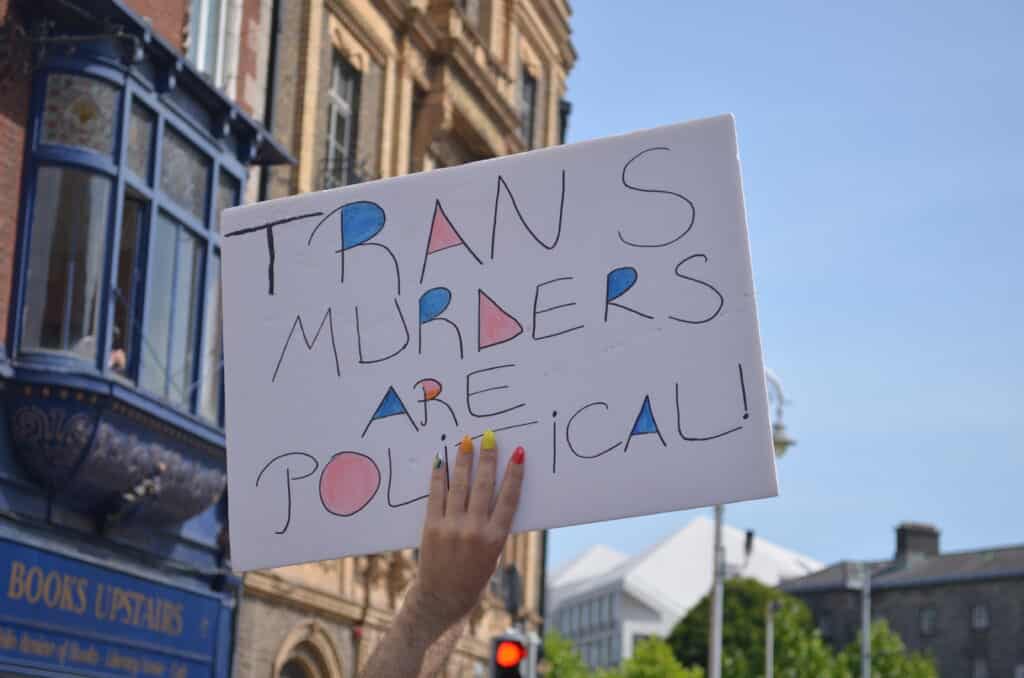 A sign saying 'trans murders are political'