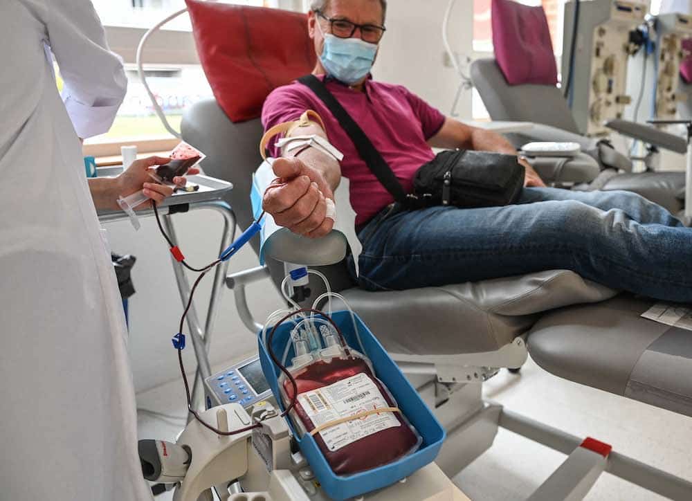 A man donates blood in hospital