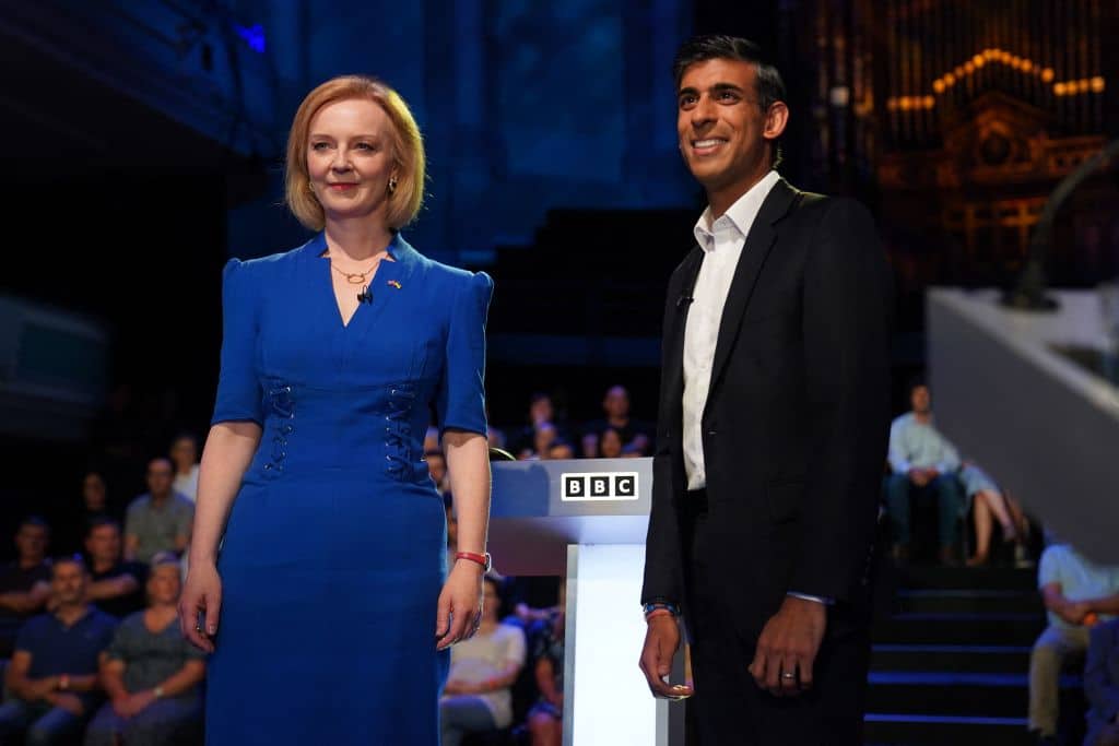 Liz Truss (L) and Rishi Sunak, contenders to become the country's next prime minister, arrive to take part in the BBC's 'The UK's Next Prime Minister: The Debate'.