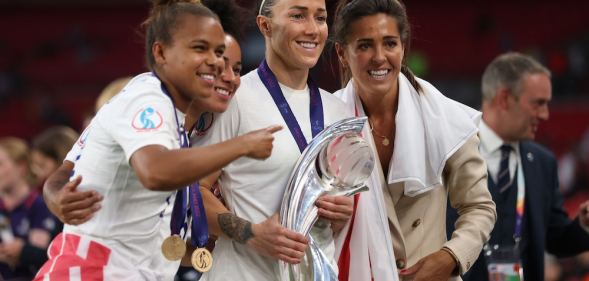 Lionesses Nikita Parris, Demi Stokes, Lucy Bronze and Fara Williams pose with the trophy after the UEFA Women's Euro England 2022 final match between England and Germany