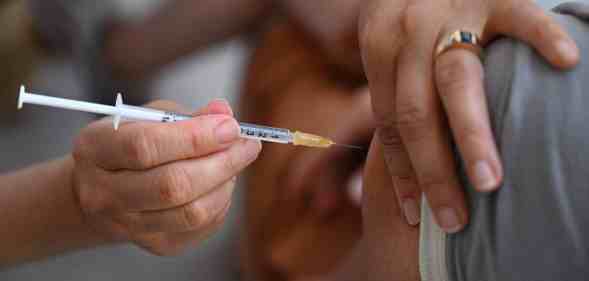 A person receiving a vaccine.