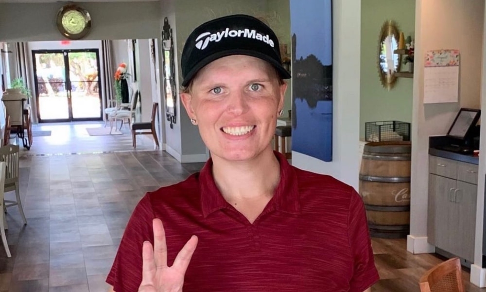 In this photograph, Hailey Davidson poses while wearing a hat