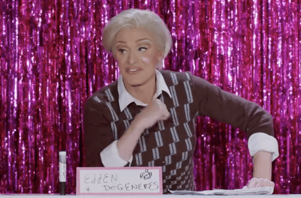Screenshot of drag queen Minnie Cooper in drag as Ellen DeGeneres