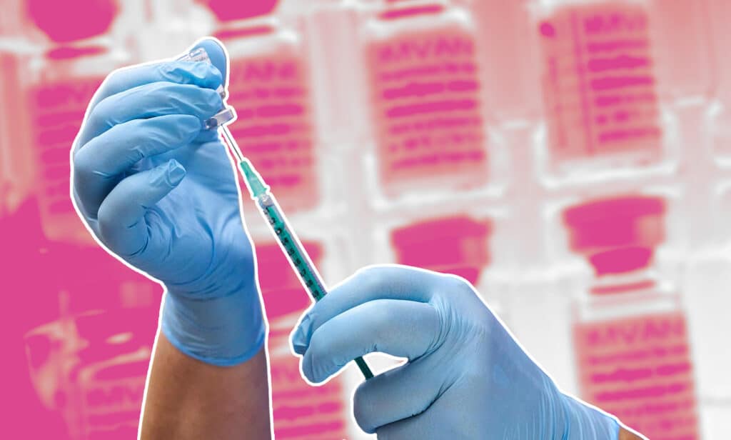 Gloved hands preparing a vaccine on a pink background