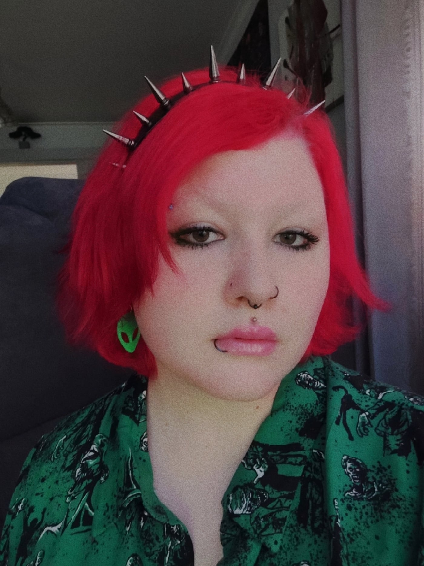 Lilly, a Yungblud fan, pictured with red hair and a spiky hairband.