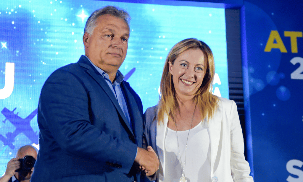 Giorgia Meloni shakes hands with Viktor Orban