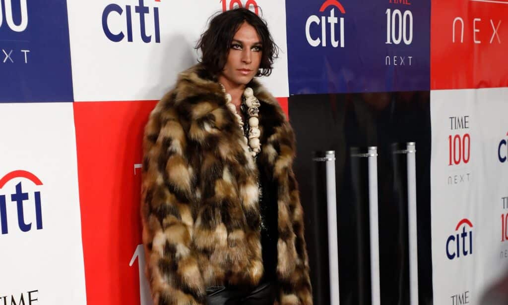 A photo of actor Ezra Miller wearing a fur-style coat . (Getty)