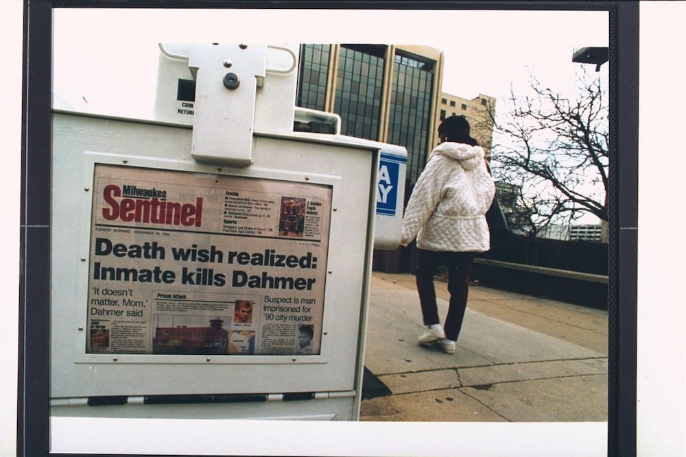 Newspaper vending machine shows a headline that reads: "Death wish realised: Inmate kills Dahmer.