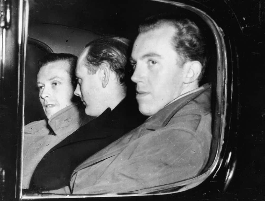 Michael Pitt Rivers, Lord Montagu of Beaulieu and Peter Wildeblood, leaving court after being found guilty of gross indecency for homosexual activity, London, March 25th 1954.