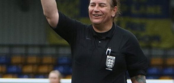 Trans football referee Lucy Clark smiles as she officiates a match