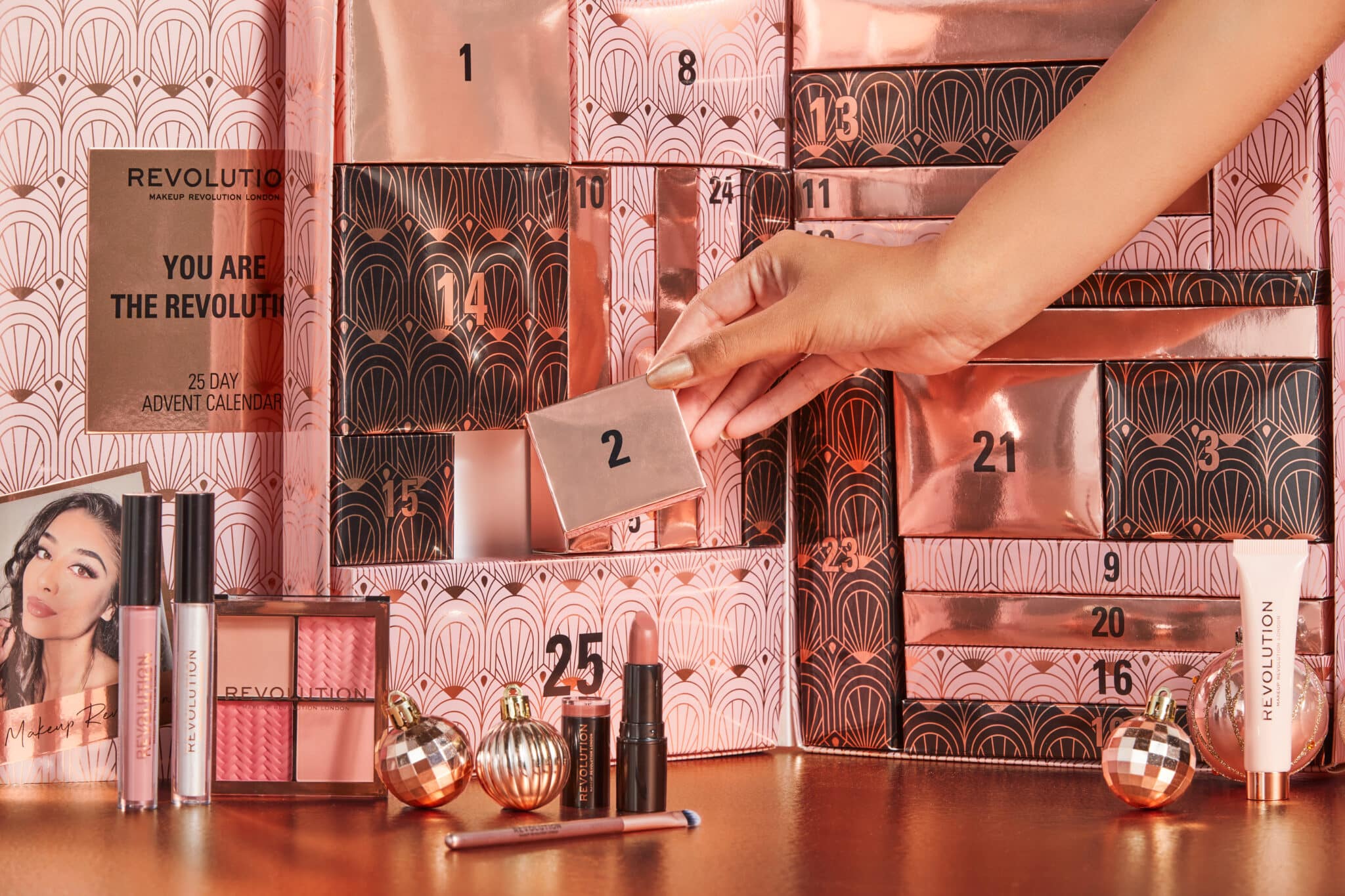 Revolution Beauty Advent Calendar features 25 doors with gifts behind each one.