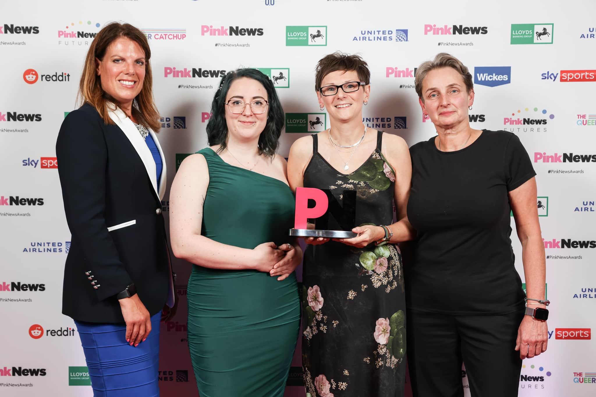 Caroline Nokes (L) with winners of the Public Sector Equality Award at the PinkNews Awards 2022. 