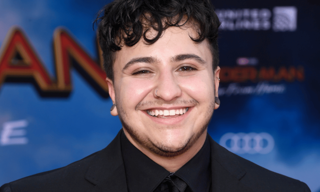Zach Barack wears a dark suit as he appears at the Marvel Spider-Man Far From Home premiere
