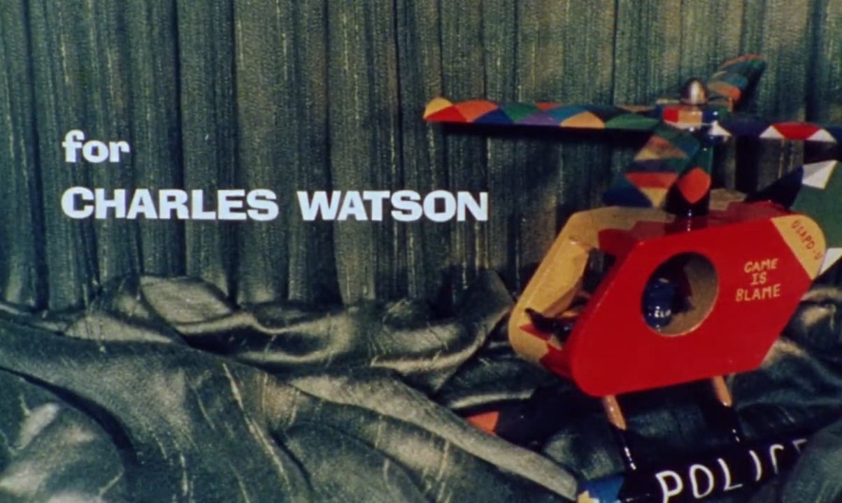 The toy helicopter gifted to Waters by Charles Watson with the words "for Charles Watson" on screen