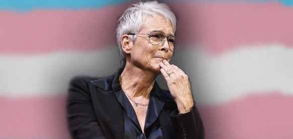 Jamie Lee Curtis in front of the trans flag