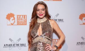 Actor Lindsay Lohan poses for a photo at a public event. (Getty)