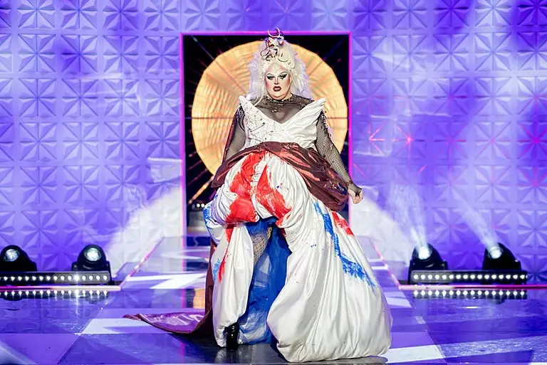Drag Queen Pixie Polite posing on a runway