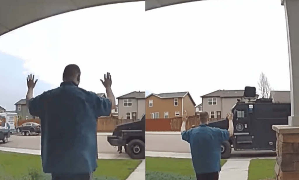 Ring doorbell camera video shows Anderson Lee Aldrich with their hands in the air surrendering to police