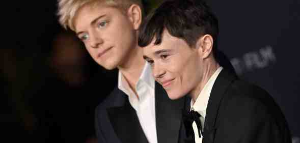 A photo of comedian Mae Martin and actor Elliot Page wearing tuxedos to a film event in LA