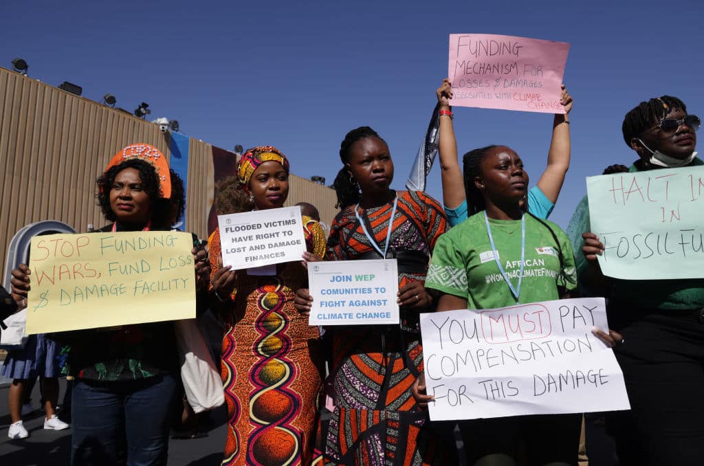African activists demanding climate finance and compensation payments from rich countries to poor countries disproportionately affected by climate change and fossil fuel exploitation at COP27.
