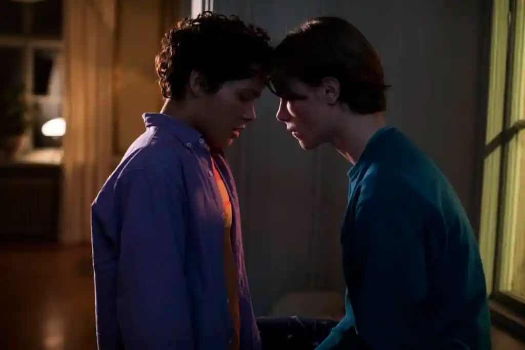Simon (L) and Wilhelm (R) kiss for the first time in Young Royals. (Netflix)