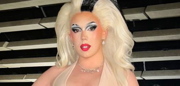 Miss Peaches dressed in a blonde wig and makeup for a Drag event.