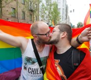 Two men kiss during Kyiv Pride, 2019. (Photo by Pavlo Gonchar/SOPA Images/LightRocket via Getty Images)