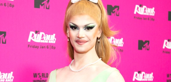 Drag Race season 15 contestant Marcia Marcia Marcia in a green dress and orange wig