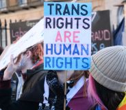 A trans rights supporter holds up a sign reading "Trans Rights are Human Rights" during a protest against the UK Goverment Section 35 stopping Scotland's gender recognition reform bill