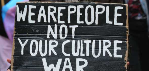 Protest sign reads We are People not your Culture War