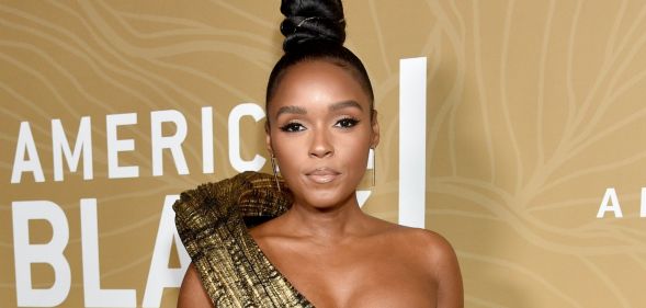 Janelle Monáe wears a gold and black dress at the American Black Film Festival Honors.