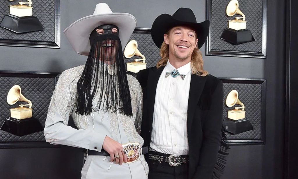 Orville Peck and Diplo laughing at the Grammys 2020