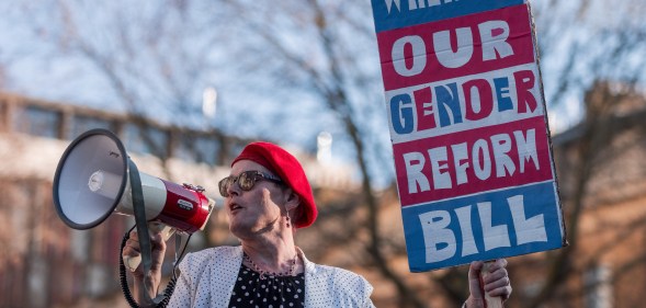 A trans rights activist addresses a protest opposite Downing Street in January 2023. (Mark Kerrison/Getty)