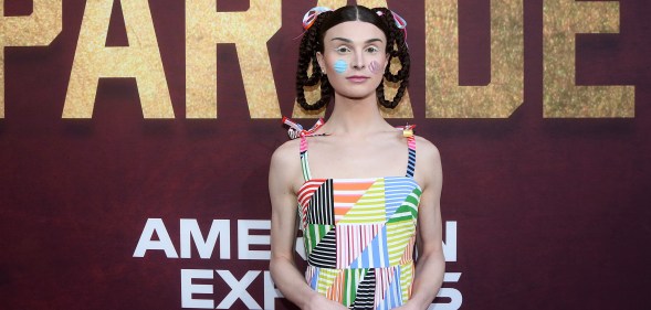 TikTok star Dylan Mulvaney wears a colourful dress with her hair in braids