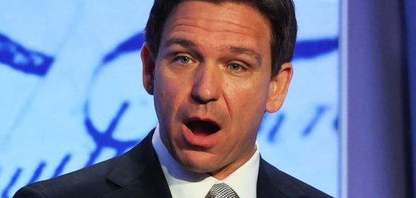 Ron DeSantis, mouth open, speaks during an event.