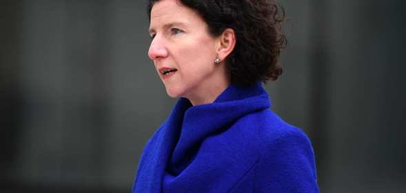 Anneliese Dodds pictured at an event. She is wearing a blue coat and is photographed outdoors.