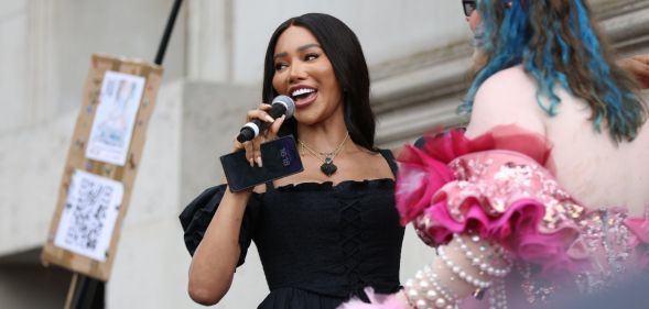 Trans activist, model and writer Munroe Bergdorf wears a black dress as she speaks to a crowd gathered for London Trans+ Pride