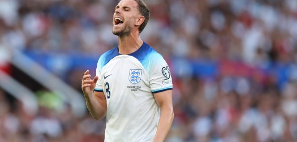 England footballer Jordan Henderson wearing a white and blue strip during a match