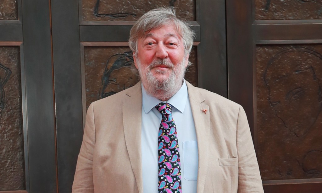 Stephen Fry feared he would be 'cursed' for being gay.