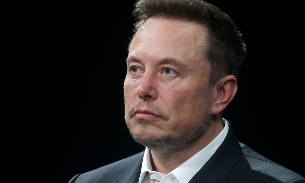 Elon Musk is seen wearing a white shirt and dark suit jacket. The X owner has hit out after several groups and LGBTQ+ activists have warned of rising levels of hate speech on the platform