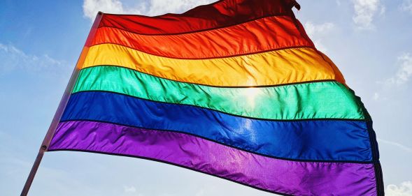 Stock image of a rainbow flag waving