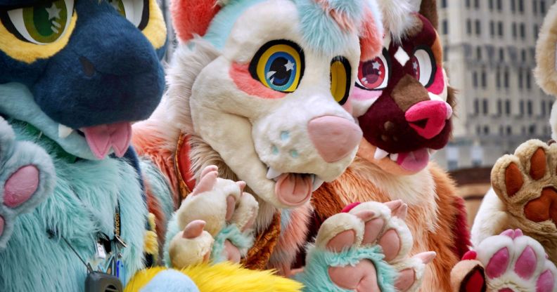 A group of people dress up as anthropomorphic animals, aka furries, in an illustration for an article about LGBTQ+ protests