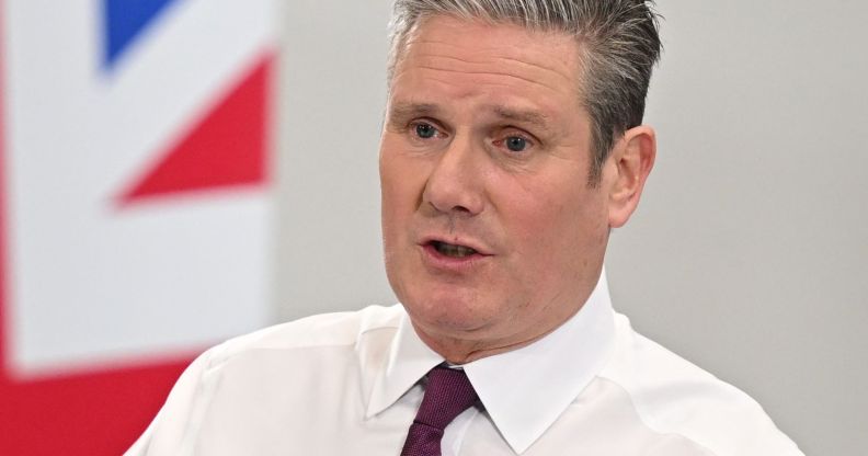 Keir Starmer speaks infront of a UK flag.