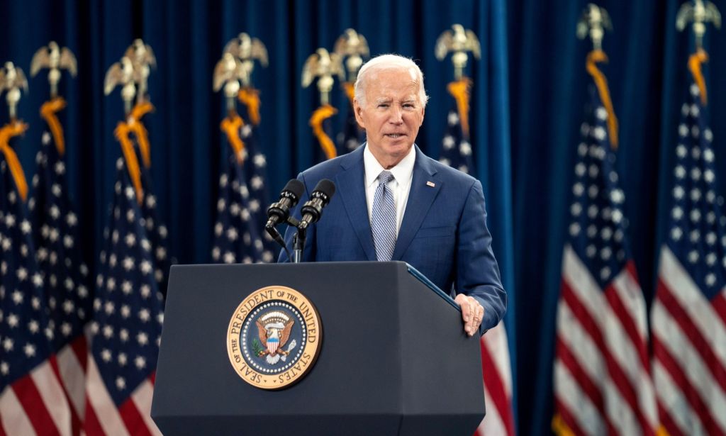 President Joe Biden speaks at a podium while announcing new initiatives expanding access to abortion and contraception on the anniversary of the Roe v Wade ruling