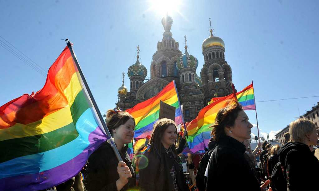 TOPSHOT - Gay rights activists march in Russia's second city of St. Petersburg May 1, 2013, during their rally against a controversial law in the city that activists see as violating the rights of gays. AFP PHOTO / OLGA MALTSEVA (Photo by OLGA MALTSEVA / AFP) (Photo by OLGA MALTSEVA/AFP via Getty Images)